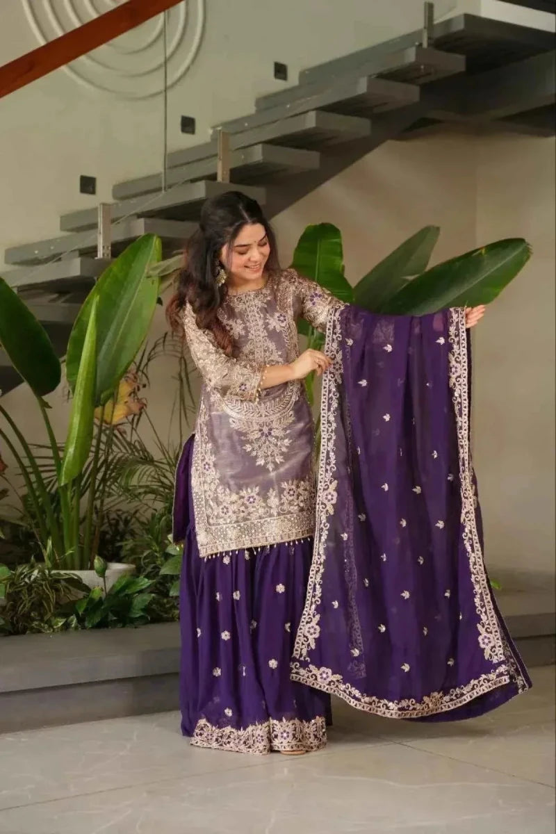 Purple embroidered sharara suit set with long tunic, flared skirt, and patterned dupatta