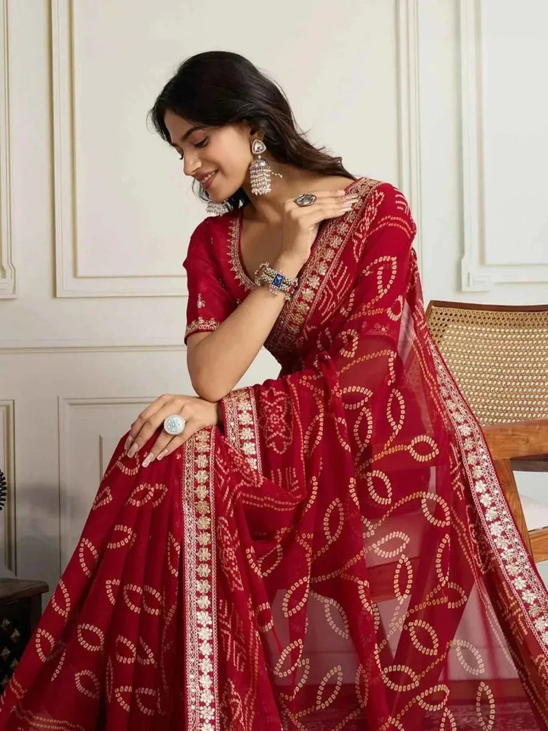 Red georgette bandhani saree with embroidered border and woven gold motifs