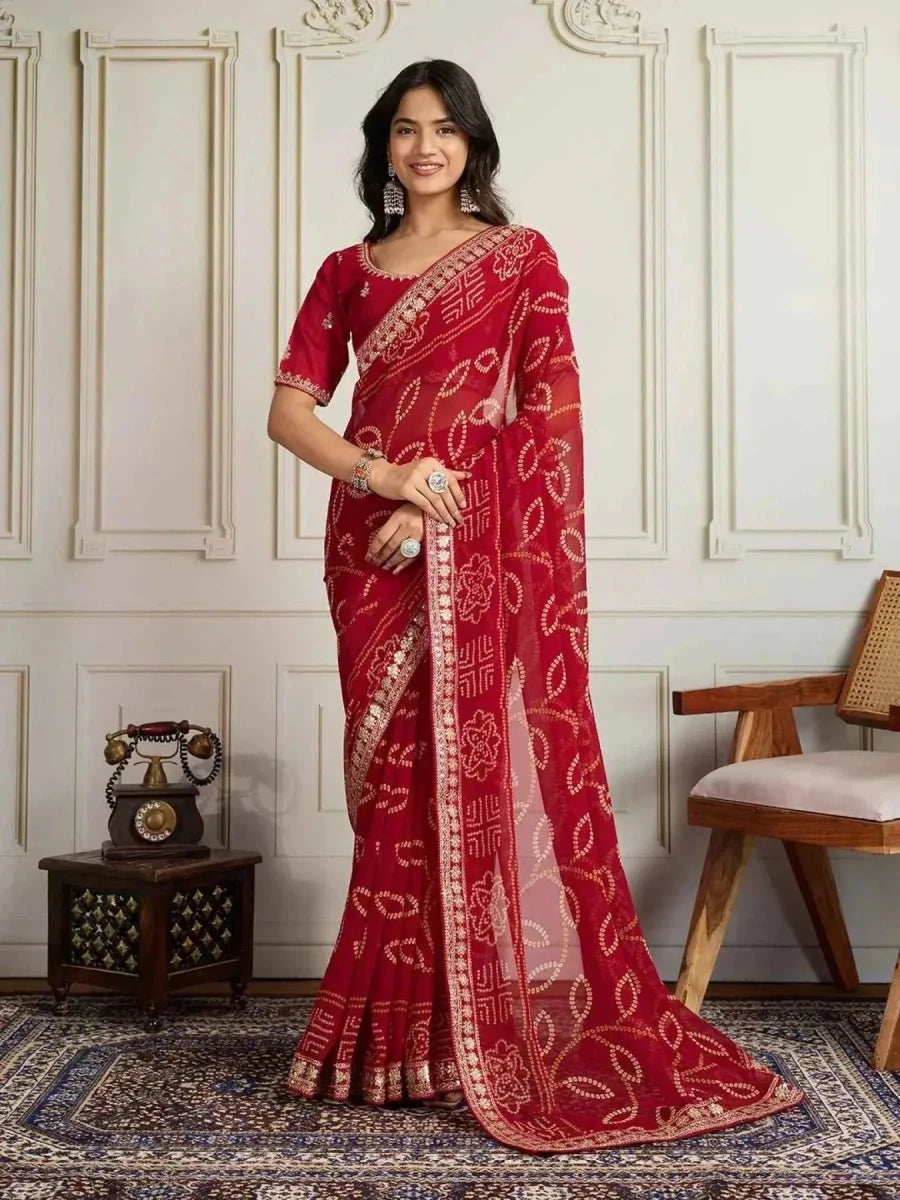 Red georgette bandhani saree, draped with embroidered border and gold motif trim