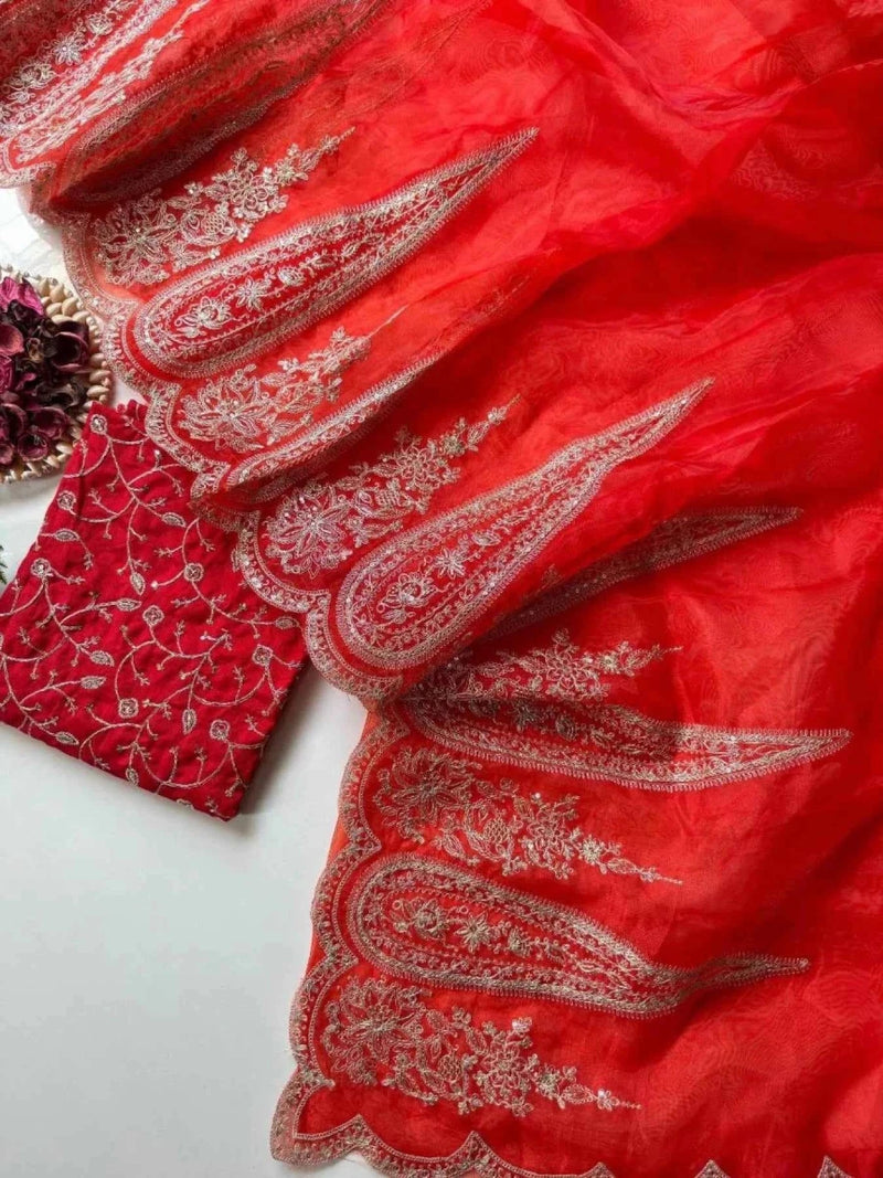 Red organza fabric with gold threadwork embroidery on folded sections