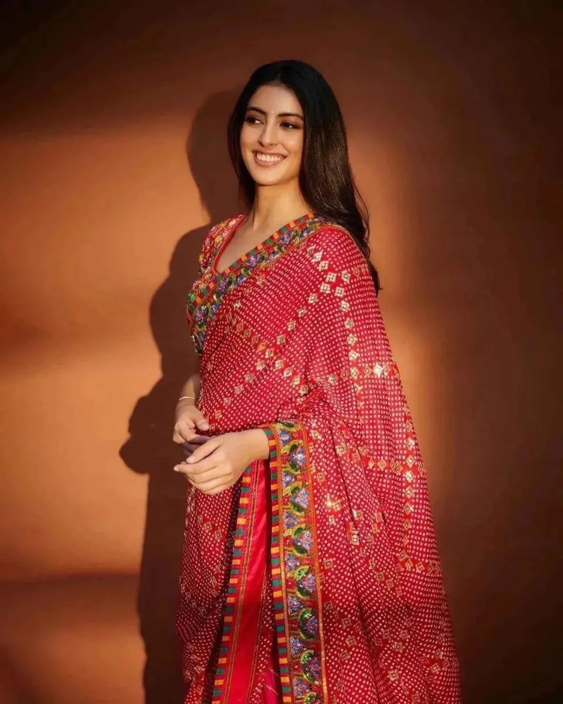 Red and pink saree with bandhani detailing, multicolor pallu border, sequins