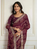 Wine bandhani saree with embroidered border, maroon drape and matching blouse