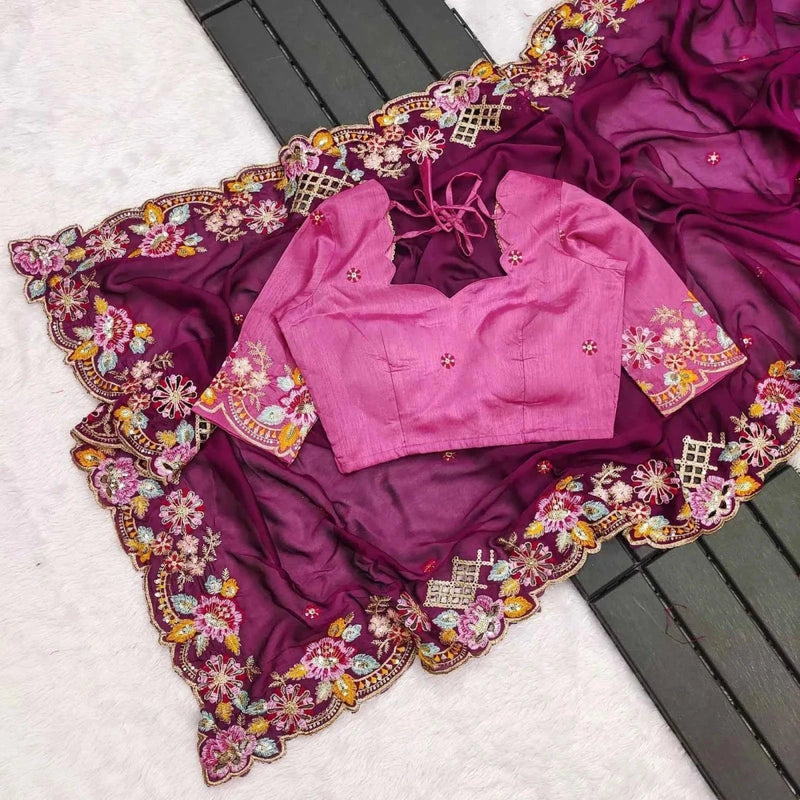 Wine purple saree laid flat with ornate floral border and sequin highlights