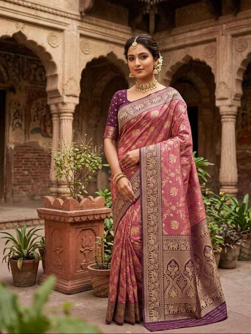 Maroon saree with gold elephant motif and wide ornate border, draped on model
